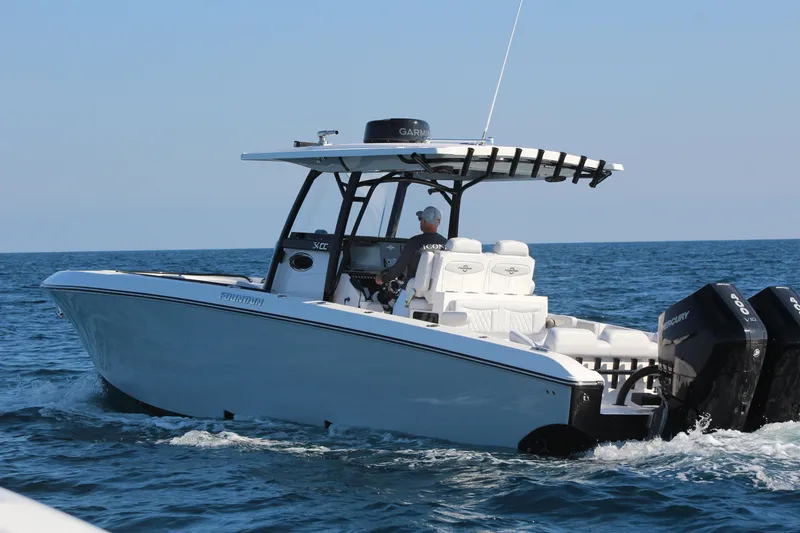 Slide: The Image of 2025 Fountain 34 Center Console boat cruising on open water. - 7