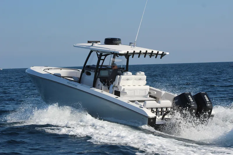 Slide: The Image of 2025 Fountain 34 Center Console boat cruising on open water. - 8