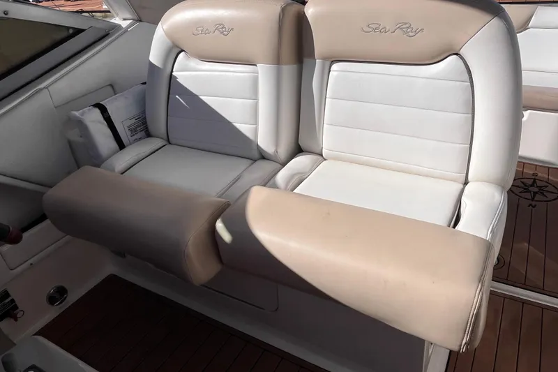Slide: The Image of 2008 Sea Ray 330 Sundancer boat seats with beige and white upholstery. - 14