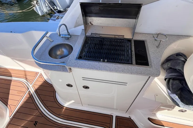 Slide: The Image of Outdoor kitchen on 2008 Sea Ray 330 Sundancer yacht with sink and grill. - 15