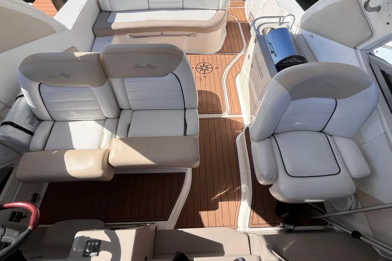 Slide: The Image of 2008 Sea Ray 330 Sundancer interior with white seating and teak flooring. - 16