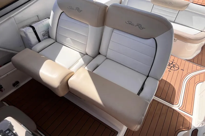 Slide: The Image of 2008 Sea Ray 330 Sundancer boat interior with beige and white seating. - 17