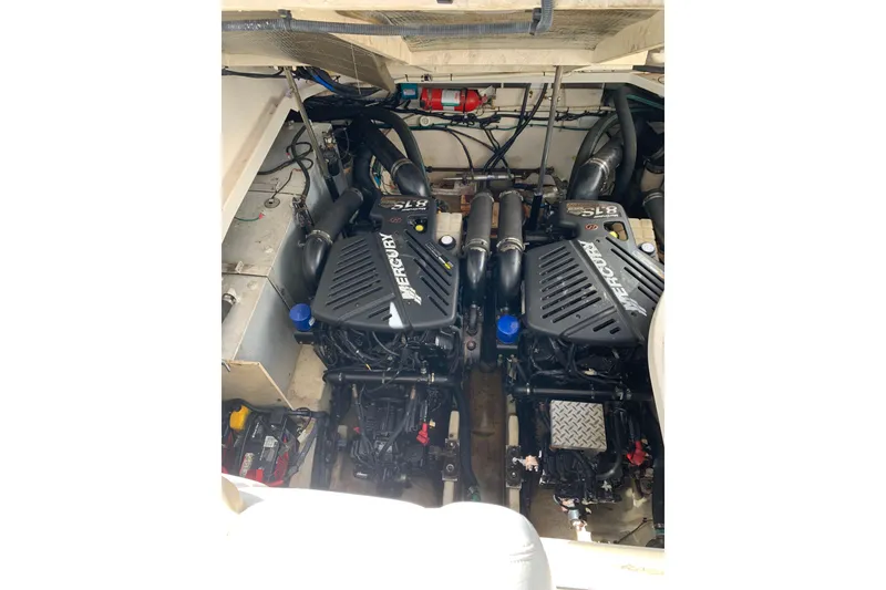Slide: The Image of Engine compartment of a 2008 Sea Ray 330 Sundancer with twin Mercury engines. - 18