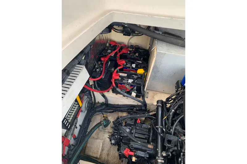 Slide: The Image of Engine compartment of 2008 Sea Ray 330 Sundancer with visible batteries and wiring. - 19
