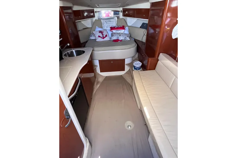 Slide: The Image of Interior of 2008 Sea Ray 330 Sundancer with cozy seating and modern amenities. - 24
