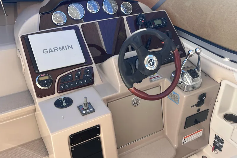 Slide: The Image of 2008 Sea Ray 330 Sundancer helm with Garmin navigation and control panel. - 27