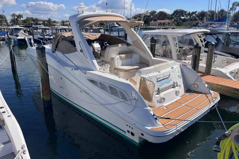 Slide: The Image of 2008 Sea Ray 330 Sundancer yacht docked at marina under clear skies. - 3