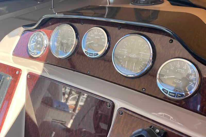 Slide: The Image of Dashboard of a 2008 Sea Ray 330 Sundancer boat with gauges and controls. - 31