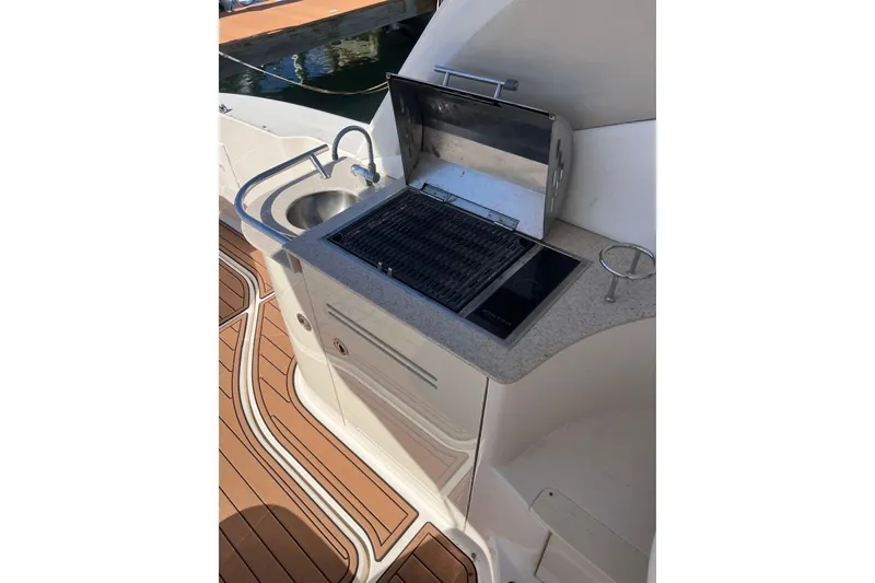 Slide: The Image of Outdoor grill and sink on 2008 Sea Ray 330 Sundancer yacht deck. - 33