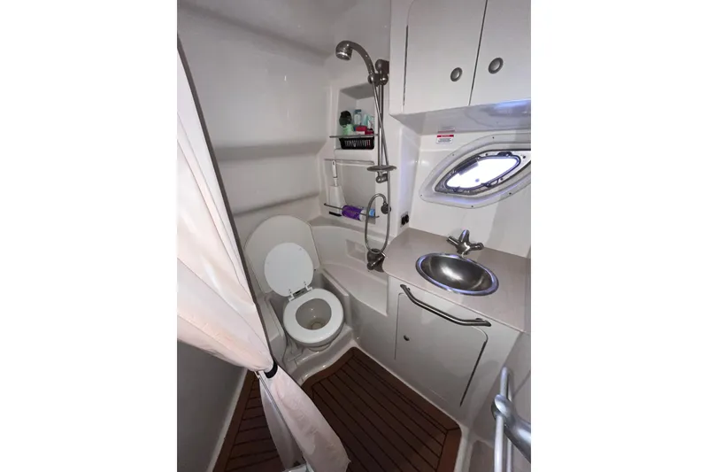 Slide: The Image of 2008 Sea Ray 330 Sundancer bathroom with shower, sink, and toilet. - 35