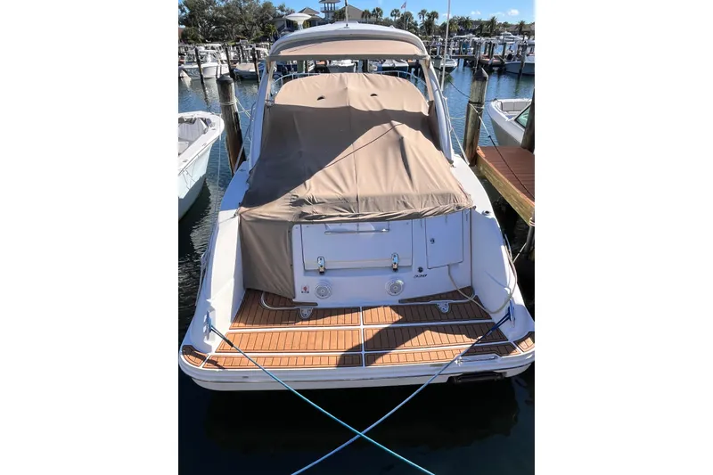 Slide: The Image of 2008 Sea Ray 330 Sundancer docked, covered, with teak swim platform. - 6