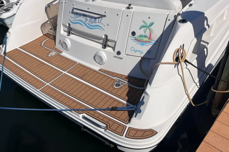Slide: The Image of 2008 Sea Ray 330 Sundancer boat with teak deck, docked at marina. - 7