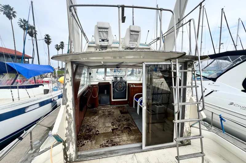 Slide: The Image of 1967 Chris-Craft 38 Constellation yacht docked, showing interior and exterior details. - 12