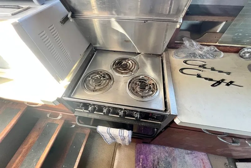 Slide: The Image of 1967 Chris-Craft 38 Constellation kitchen with stove and branded countertop. - 26