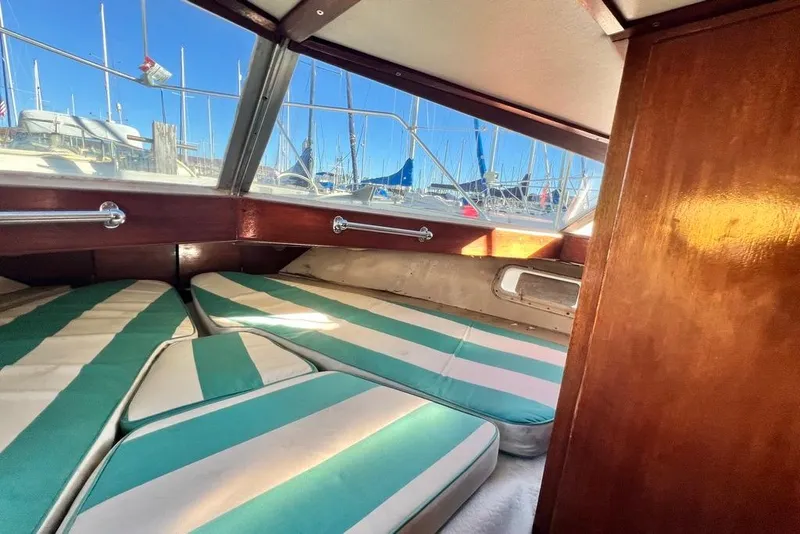 Slide: The Image of Interior of 1967 Chris-Craft 38 Constellation with striped cushions and wooden paneling. - 30