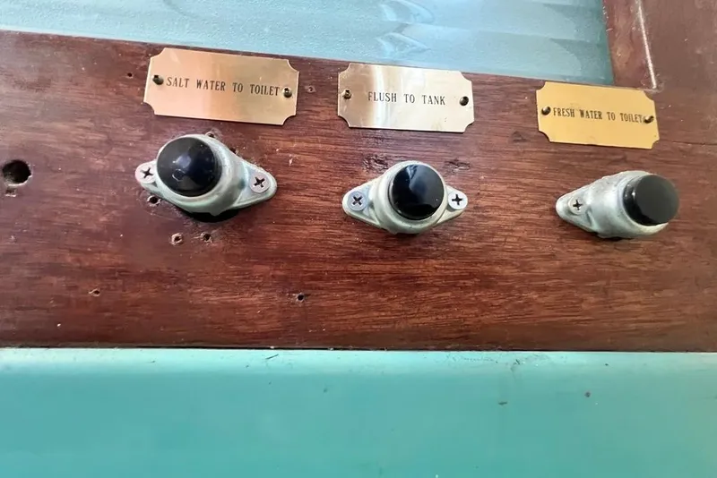 Slide: The Image of Control panel on 1967 Chris-Craft 38 Constellation boat with labeled switches. - 34