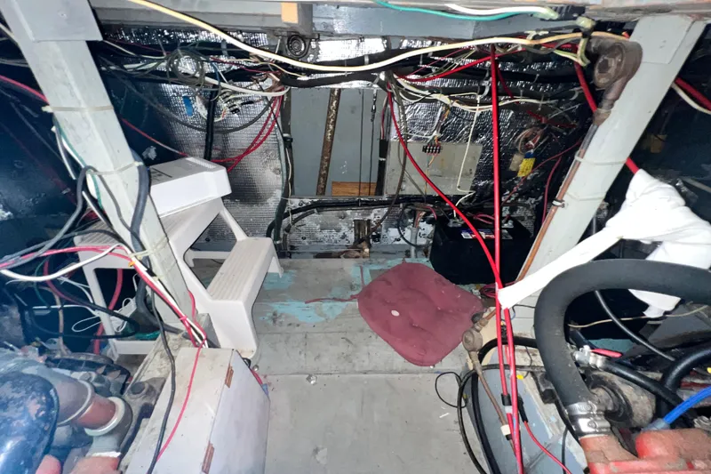 Slide: The Image of Engine room of 1967 Chris-Craft 38 Constellation with wiring and mechanical components. - 39