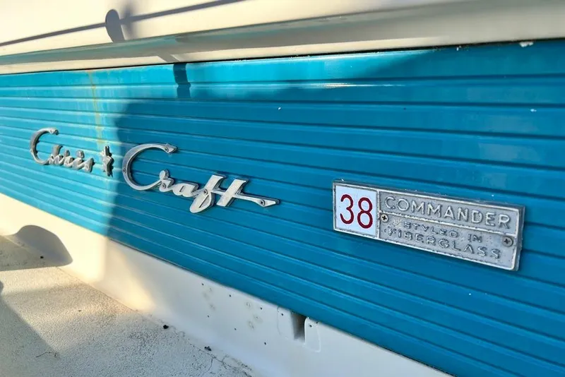 Slide: The Image of 1967 Chris-Craft 38 Constellation boat emblem and model badge on blue fiberglass. - 4