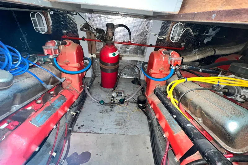 Slide: The Image of Engine room of 1967 Chris-Craft 38 Constellation with red components and wiring. - 40