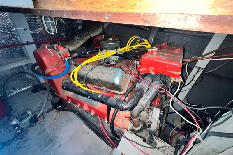 Slide: The Image of Engine compartment of a 1967 Chris-Craft 38 Constellation boat with visible wiring and components. - 41