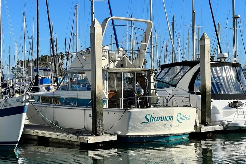 Slide: The Image of 1967 Chris-Craft 38 Constellation boat named "Shannon Queen" docked at marina. - 5