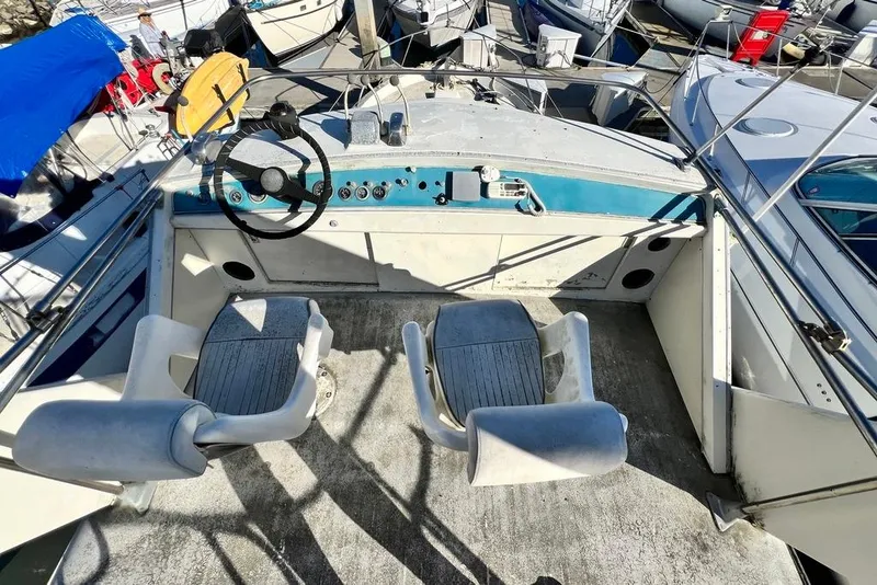 Slide: The Image of 1967 Chris-Craft 38 Constellation boat cockpit with dual seats and steering wheel. - 7