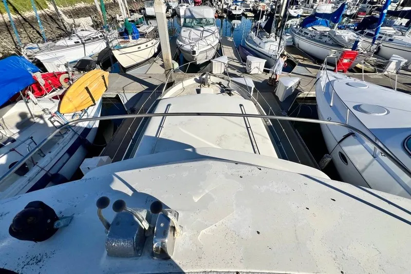 Slide: The Image of 1967 Chris-Craft 38 Constellation docked among other boats in a marina. - 8