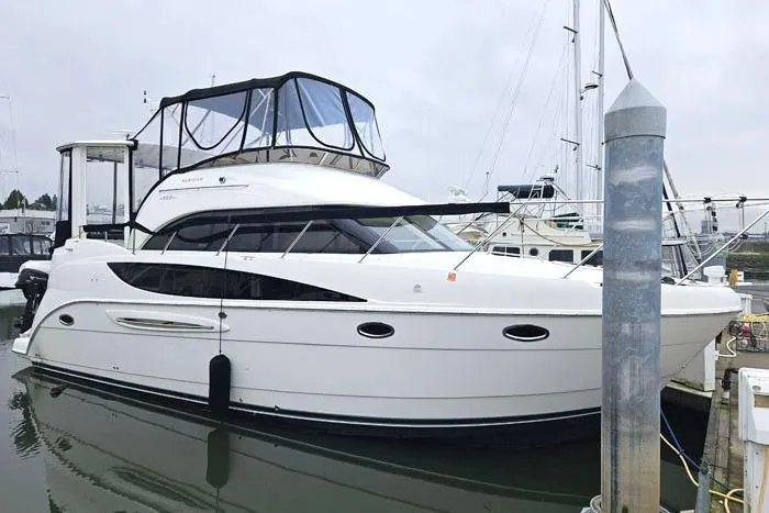 The Image of 2006 Meridian 368 Motoryacht docked in a marina, featuring sleek design and spacious flybridge. - 0