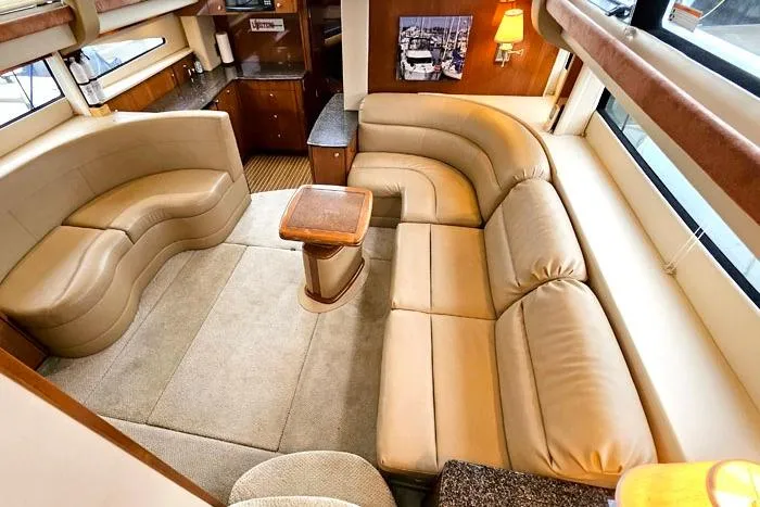 Slide: The Image of Luxurious interior of 2006 Meridian 368 Motoryacht with plush seating and elegant decor. - 10