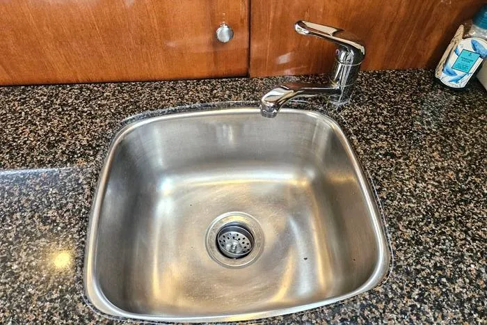 Slide: The Image of Stainless steel sink with faucet on granite countertop in 2006 Meridian 368 Motoryacht. - 13