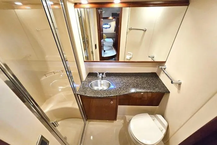 Slide: The Image of Luxurious bathroom in 2006 Meridian 368 Motoryacht with granite countertop and modern fixtures. - 20