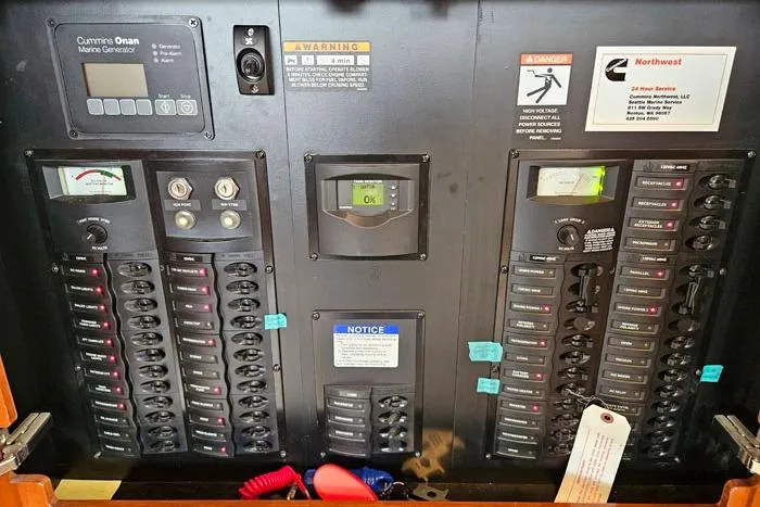 Slide: The Image of Electrical panel of 2006 Meridian 368 Motoryacht with Cummins Onan marine generator controls. - 21