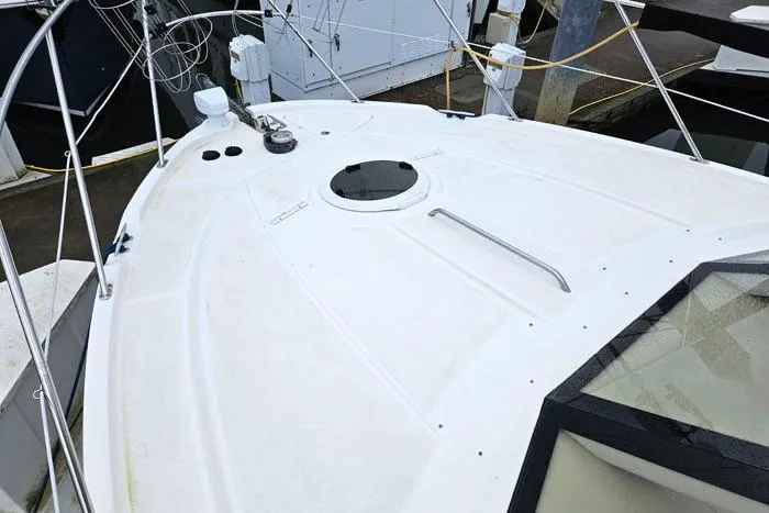 Slide: The Image of 2006 Meridian 368 Motoryacht deck with hatch and railing at marina. - 29