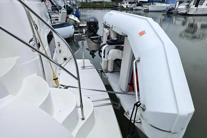 Slide: The Image of 2006 Meridian 368 Motoryacht with dinghy, docked at marina. - 4