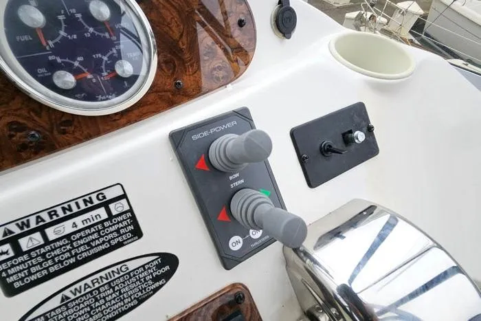 Slide: The Image of Control panel of a 2006 Meridian 368 Motoryacht with side-power controls and warning labels. - 8