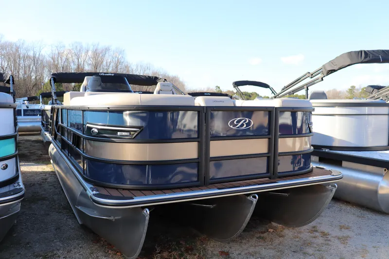 Slide: The Image of 2026 Bentley Pontoons 223 Elite Admiral, blue and beige, docked on land. - 0