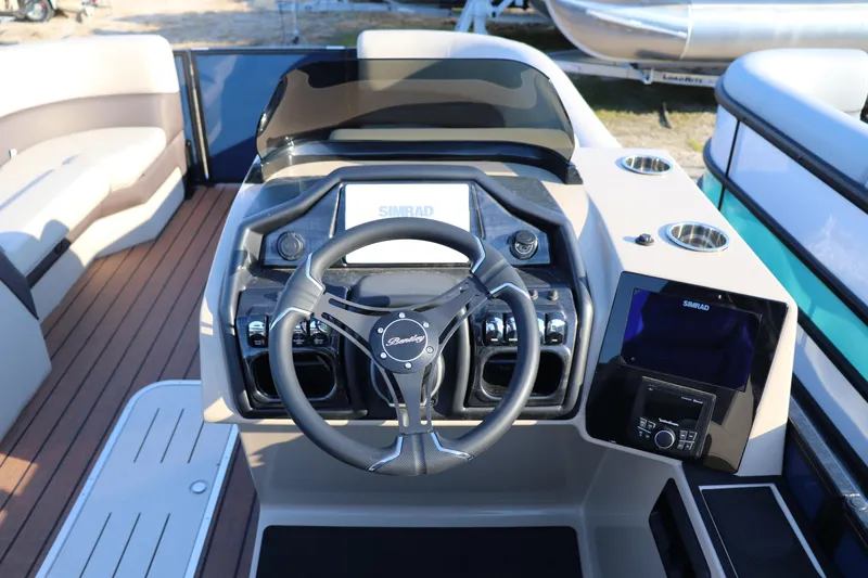 Slide: The Image of 2026 Bentley Pontoons 223 ELITE ADMIRAL helm with steering wheel and control panel. - 5