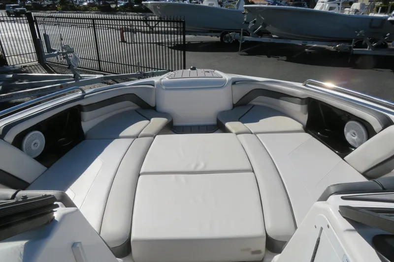 Slide: The Image of 2017 Yamaha Boats AR240 interior with sleek seating and modern dashboard design. - 14