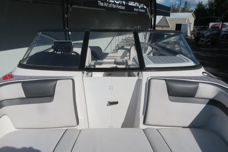 Slide: The Image of 2017 Yamaha Boats AR240 interior with cushioned seating and sleek design. - 15