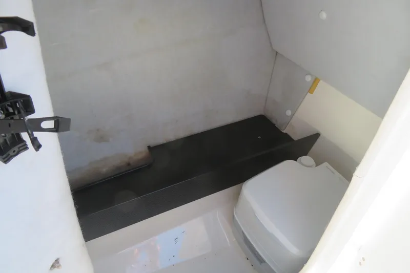 Slide: The Image of 2017 Yamaha AR240 boat storage compartment with red life jacket inside. - 24