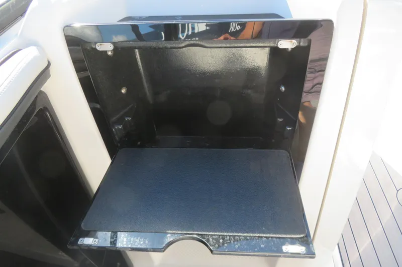 Slide: The Image of 2017 Yamaha AR240 boat interior with cushioned seating and speaker. - 27