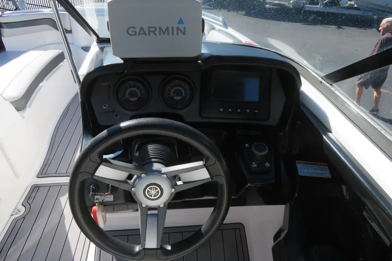 Slide: The Image of 2017 Yamaha Boats AR240 interior with sleek design and modern flooring. - 29
