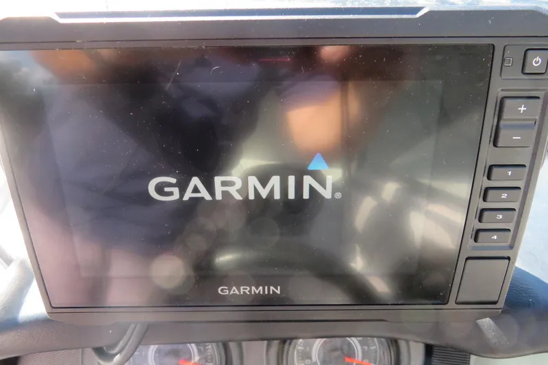 Slide: The Image of 2017 Yamaha AR240 boat interior with portable toilet and storage area. - 31