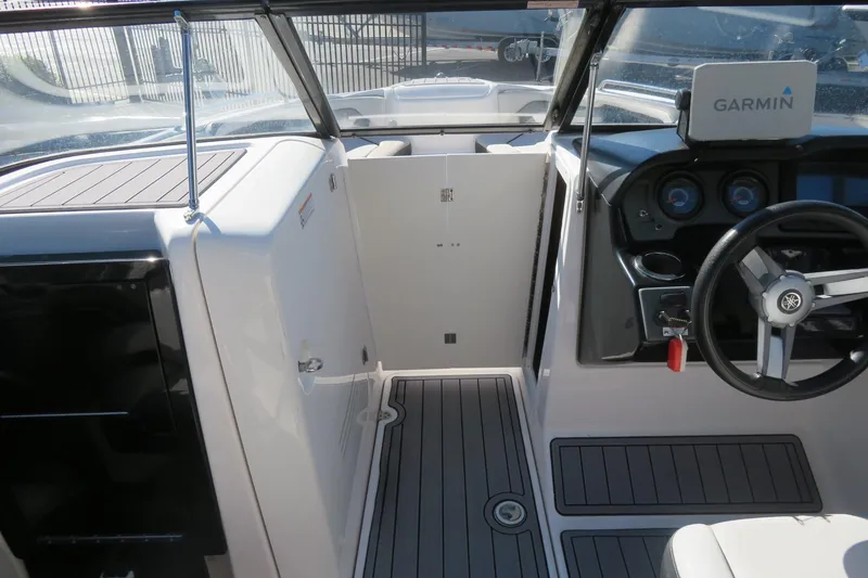 Slide: The Image of 2017 Yamaha AR240 boat dashboard with 12V power outlet. - 44