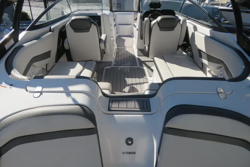 Slide: The Image of 2017 Yamaha Boats AR240, rear view, parked outdoors on a sunny day. - 8