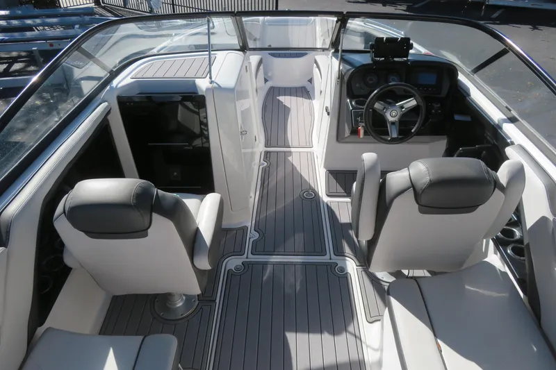 Slide: The Image of Red hull of a 2017 Yamaha Boats AR240 on a trailer. - 9