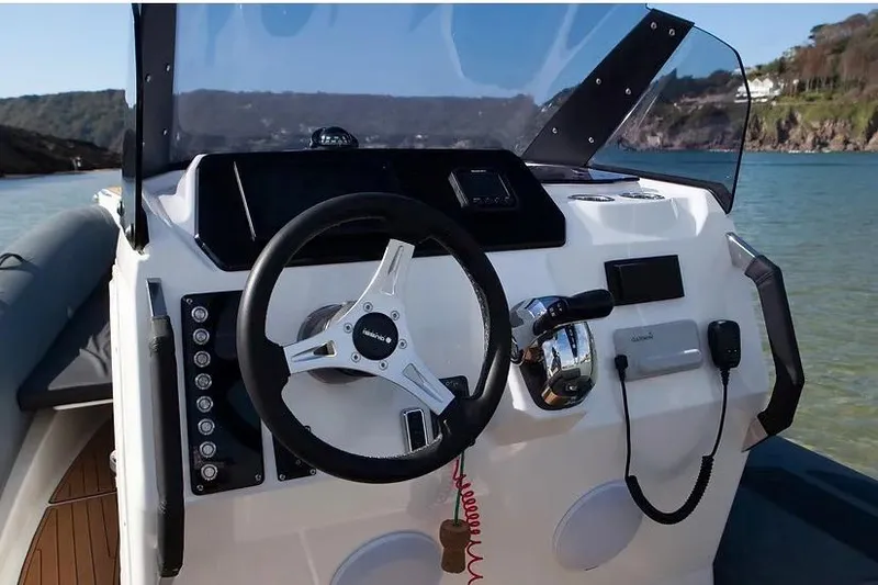 Slide: The Image of Manufacturer Provided Image: Cockpit of 2026 Brig Eagle 8 boat with steering wheel and controls. - 5