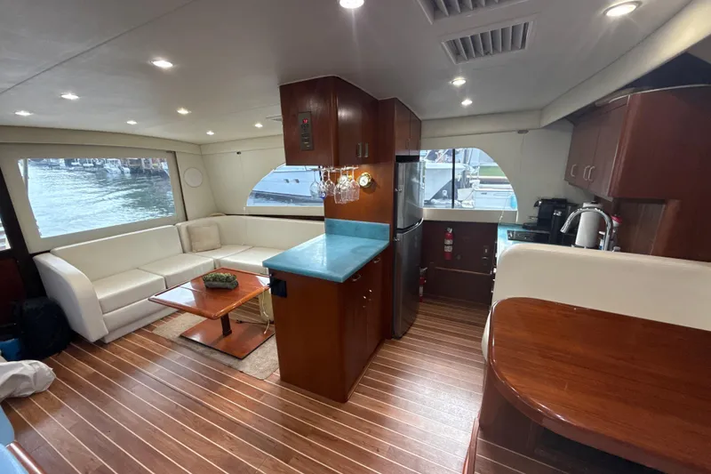 Slide: The Image of Luxurious interior of 1992 Ocean Yachts 48 Super Sport with modern kitchen and seating area. - 16