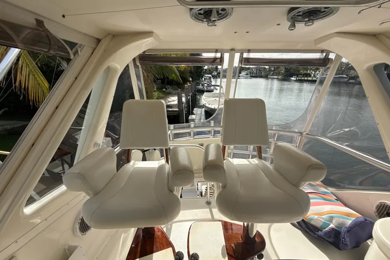 Slide: The Image of Interior view of 1992 Ocean Yachts 48 Super Sport with two white captain's chairs. - 25