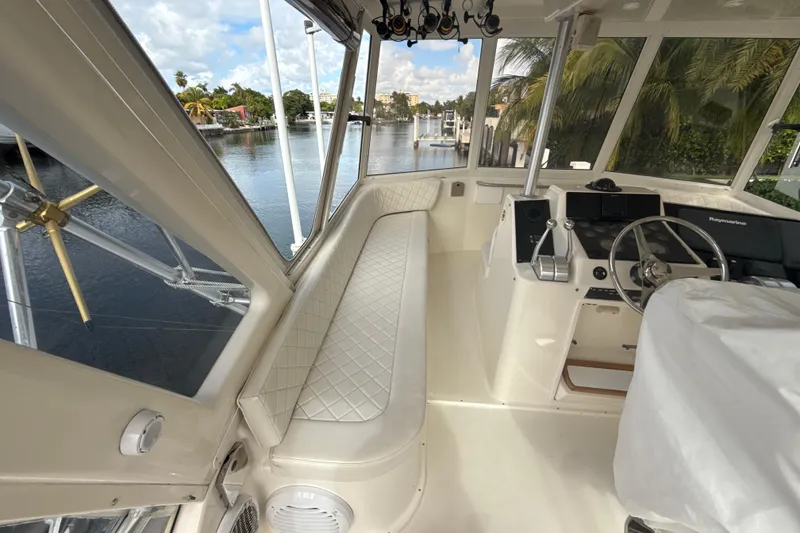 Slide: The Image of Interior view of 1992 Ocean Yachts 48 Super Sport, featuring helm and seating area. - 27